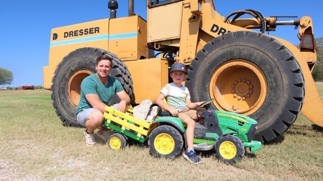 'Using real tractors to move rocks on the farm | Tractors for kids | Working on the farm'