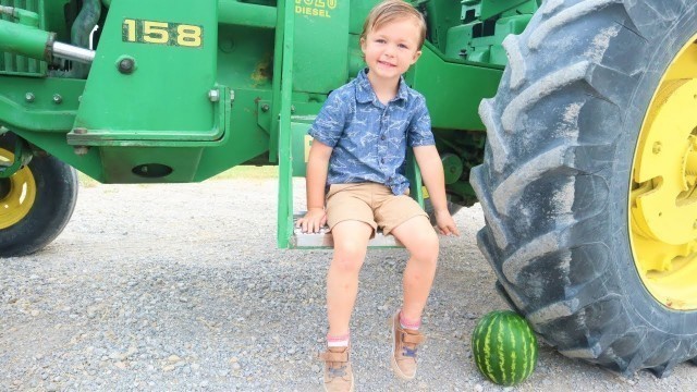 'Using tractors on the farm to crush things | Tractors for kids'