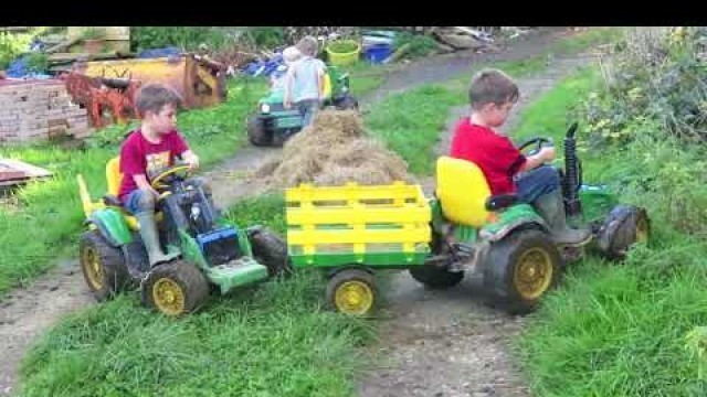 'Kids Playing on ride on tractors loading hay, children play on the farm, TRACTOR SONG'