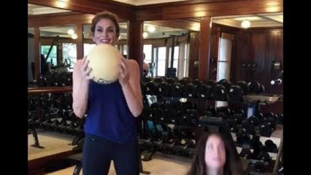 'Cindy Crawford works out with personal trainer at the gym'