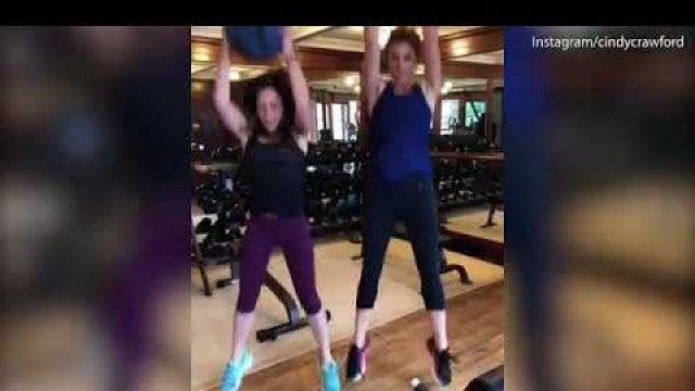 'Cindy Crawford works out with her personal trainer at the gym'