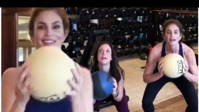 'Cindy crawford working with his personal trainer at the gym'